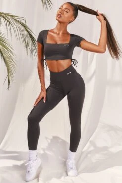 Slinky Crop Top In Black 11 Slinky Crop Top In Black -Sculpt Sets Body bt0008 bt0009 4 black short sleeved side tied bust flattering crop top high waisted leggings two piece workout sportswear 319bff0c 8393 42a2 8759 fd94a251f257
