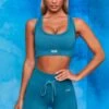 On Repeat Ribbed Tie Front Cycling Shorts In Teal 1 On Repeat Ribbed Tie Front Cycling Shorts In Teal -Sculpt Sets Body bt0100 bt0105 1 shape on repeat teal racer back sports bra high wasit tie front cycling shorts sportswear set