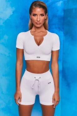 Perform Ribbed Short Sleeve Zip Front Crop Top In White