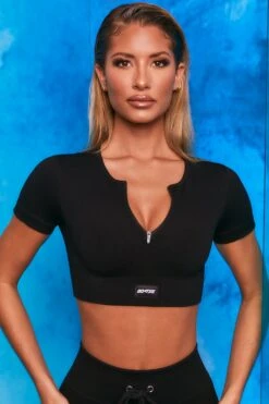 Perform Ribbed Short Sleeve Zip Front Crop Top In Black 10 Perform Ribbed Short Sleeve Zip Front Crop Top In Black -Sculpt Sets Body bt0102 bt0104 3 perform results black zip front short sleeve crop top tie front shorts sportswear set