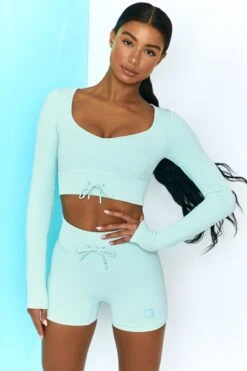 Time Check Ribbed Long Sleeve Crop Top In Light Blue -Sculpt Sets Body bt0301 bt0306 2 move it time check light blue long sleeved strap crop top tie front shorts ribbed pastel