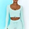 Time Check Ribbed Long Sleeve Crop Top In Light Blue -Sculpt Sets Body bt0301 bt0306 3 move it time check light blue long sleeved strap crop top tie front shorts ribbed pastel
