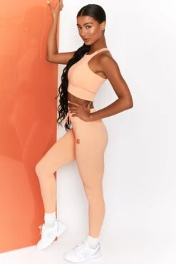 Feel Your Power Ribbed Racer Crop Top In Peach -Sculpt Sets Body bt0302 bt0304 2 energise peach ribbed drawstring workout joggers feel your power ribbed workout top 3