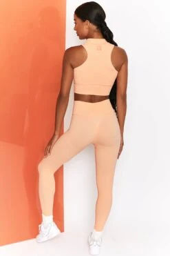 Miles Ahead Ribbed High Neck Crop Top In Peach -Sculpt Sets Body bt0305 bt0302 4 energise peach ribbed drawstring workout joggers mile ahead ribbed work out crop top 2