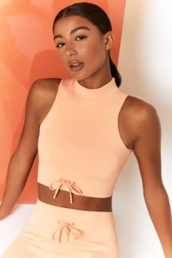 Miles Ahead Ribbed High Neck Crop Top In Peach -Sculpt Sets Body bt0305 bt0302 7 energise peach ribbed drawstring workout joggers mile ahead ribbed work out crop top 2