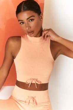 Miles Ahead Ribbed High Neck Crop Top In Peach -Sculpt Sets Body bt0305 bt0302 8 energise peach ribbed drawstring workout joggers mile ahead ribbed work out crop top 2