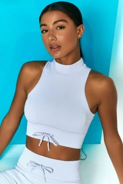 Miles Ahead Ribbed High Neck Crop Top In Cool Blue 12 Miles Ahead Ribbed High Neck Crop Top In Cool Blue -Sculpt Sets Body bt0305 bt0318 10 miles ahead cool blue ribbed sleeveless turtle neck draw string crop top long distance ribbed draw string shorts
