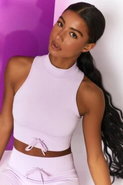 Miles Ahead Ribbed High Neck Crop Top In Lilac 12 Miles Ahead Ribbed High Neck Crop Top In Lilac -Sculpt Sets Body bt0305 bt0318 12 miles ahead lilac ribbed sleeveless turtle neck draw string crop top long distance ribbed draw string shorts