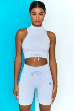 Miles Ahead Ribbed High Neck Crop Top In Cool Blue 13 Miles Ahead Ribbed High Neck Crop Top In Cool Blue -Sculpt Sets Body bt0305 bt0318 1 miles ahead cool blue ribbed sleeveless turtle neck draw string crop top long distance ribbed draw string shorts