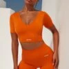 Gradient Scoop Neck Ruched Crop Top In Deep Orange -Sculpt Sets Body bt0361 bt0366 1 gradient flash deep orange scrunched front short sleeve crop top high waist shorts sportswear set 1