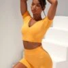 Curved Waist Seamless Mini Shorts In Light Orange 1 Curved Waist Seamless Mini Shorts In Light Orange -Sculpt Sets Body bt0361 bt0366 2 gradient flash light orange scrunched front short sleeve crop top high waist shorts sportswear set 3