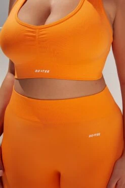 Surge Curved Waist Seamless Leggings In Orange 17 Surge Curved Waist Seamless Leggings In Orange -Sculpt Sets Body bt0364 bt0365 16 surge orange leggings beam light crop top 1
