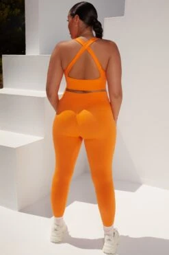Surge Curved Waist Seamless Leggings In Orange 15 Surge Curved Waist Seamless Leggings In Orange -Sculpt Sets Body bt0364 bt0365 18 surge orange leggings beam light crop top 1